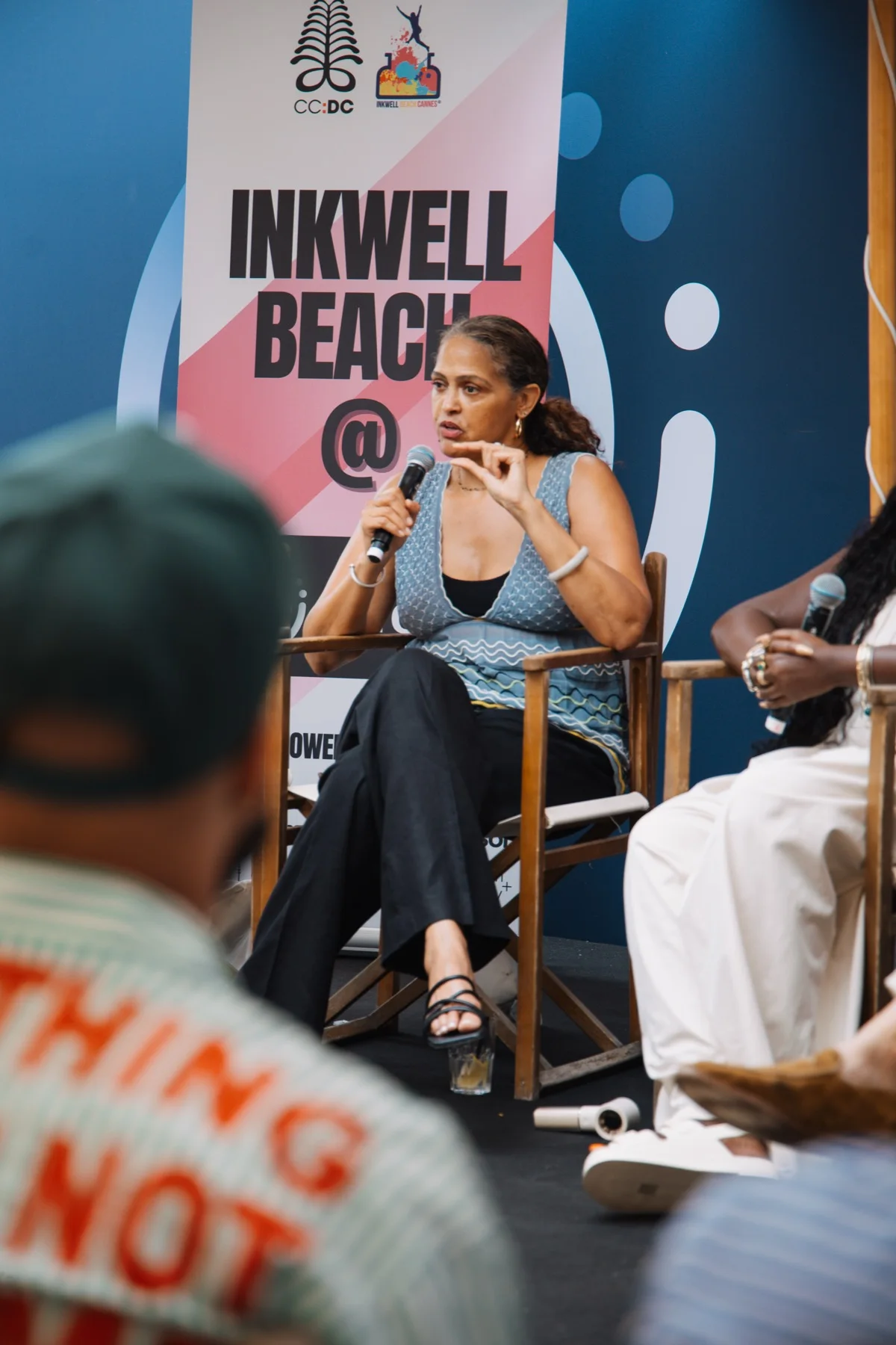 Kelly Woolfolk speaking on a panel at Inkwell Beach during Cannes Lions